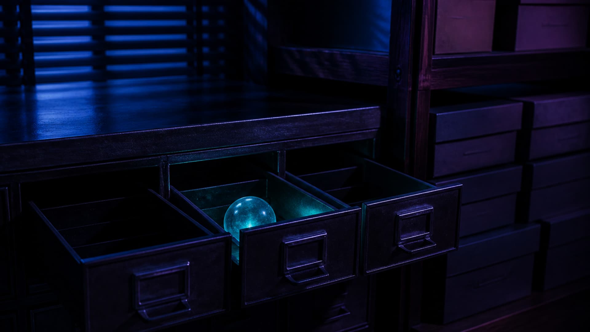 A glowing unmarked glass orb sits alone in the open middle drawer of a dark search-index cabinet, stacked archival boxes on a separate shelf to the right, with no people or readable text