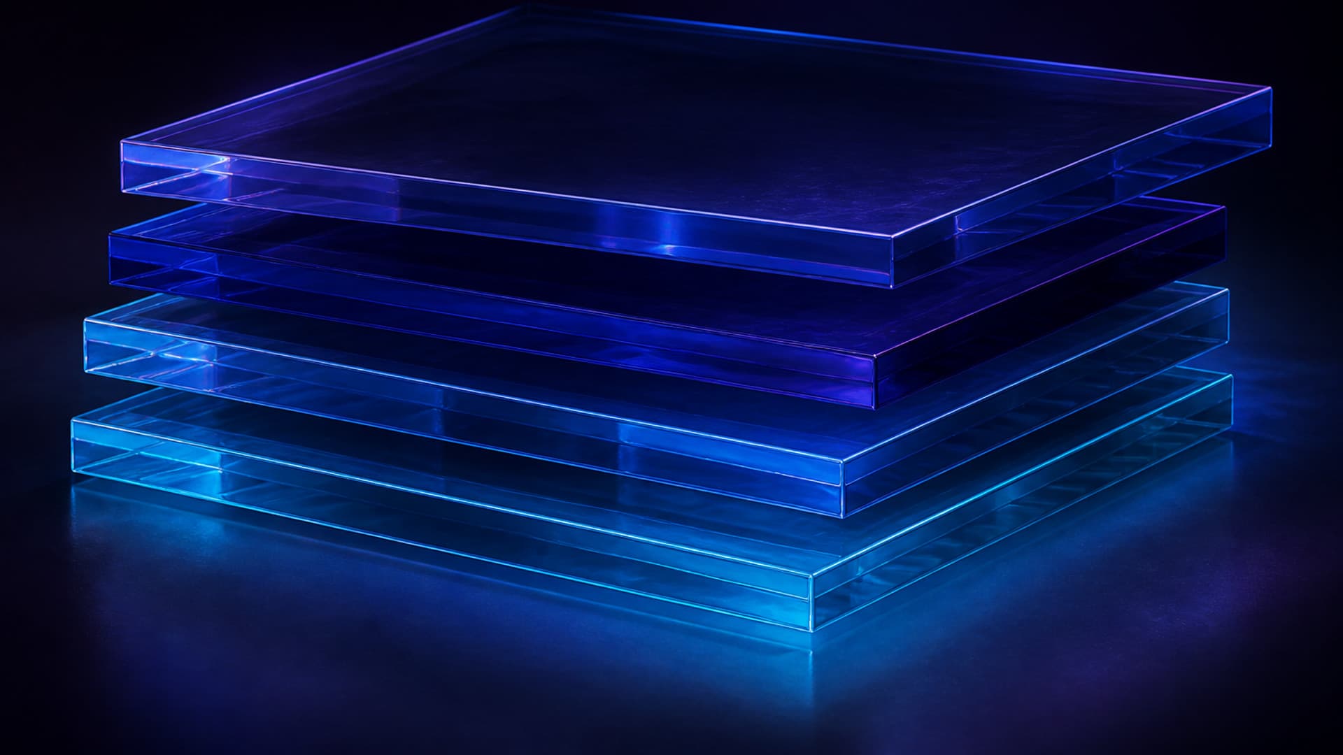 Four unmarked translucent glass slabs stacked and slightly offset in a dark studio, with cyan edges and no people or readable text