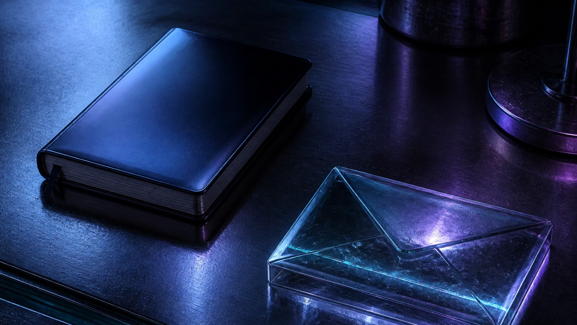 A closed unmarked glass notebook on a dark desk beside a sealed glass envelope and one faintly lit lane, with no people or readable text